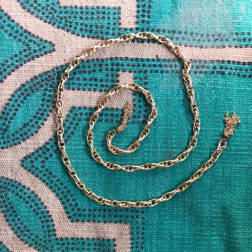 Lightweight gold-tone chain with tassels.